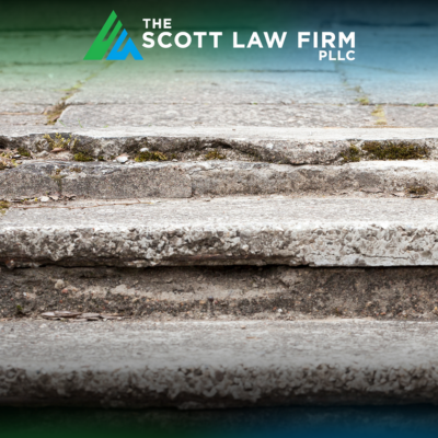 Uneven steps with crumbling concrete are a slip and fall hazard in Vancouver, WA