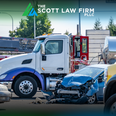 A large commercial truck in an accident in Vancouver with a small blue car