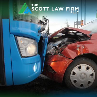 A bus striking the front end of a red car head-on in a car vs. bus accident in Vancouver, WA