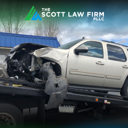 A white car being towed away after a Vancouver head-on accident