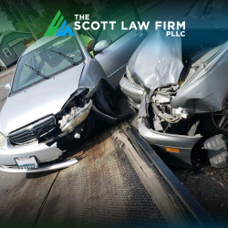 Two heavily damaged grey cars after a T-bone accident in Vancouver