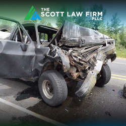 A grey truck after sustaining heavy damage in an accident on a Vancouver highway