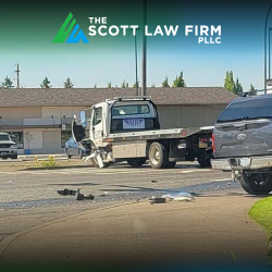 Aftermath of a Vancouver truck accident with two trucks sitting in the road, surrounded by debris