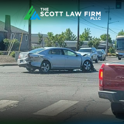 After a hit-and-run car accident in Vancouver, a damaged silver vehicle sitting in the road