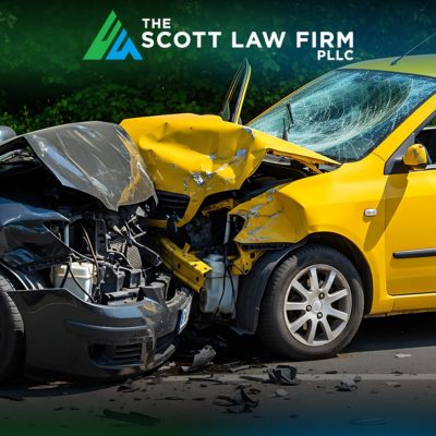 Two-car collision involving a yellow vehicle and a gray vehicle with severe front-end damage